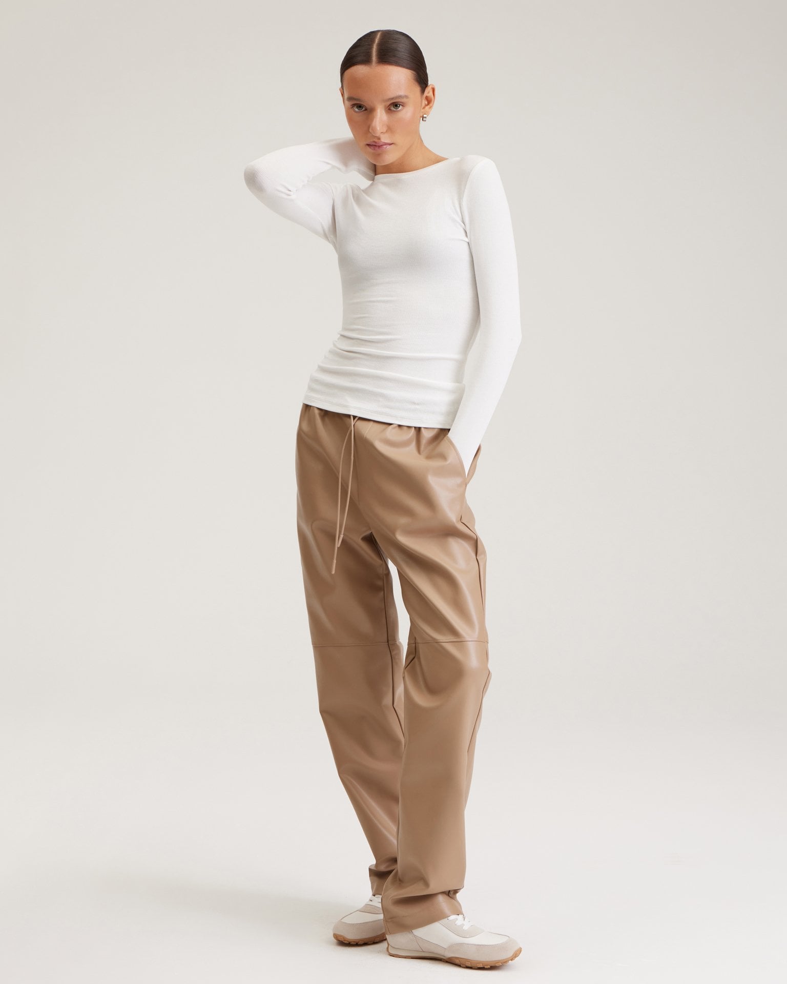 Coffee-coloured faux leather trousers