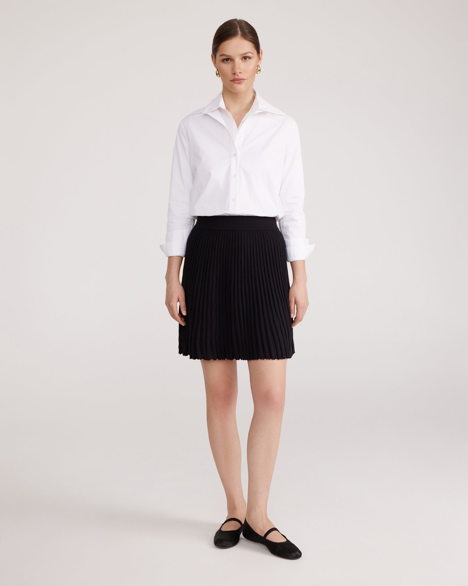 Black pleated mini skirt