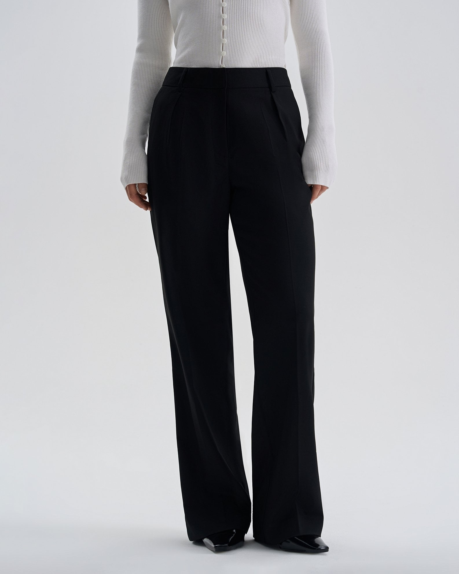Trousers with pleats