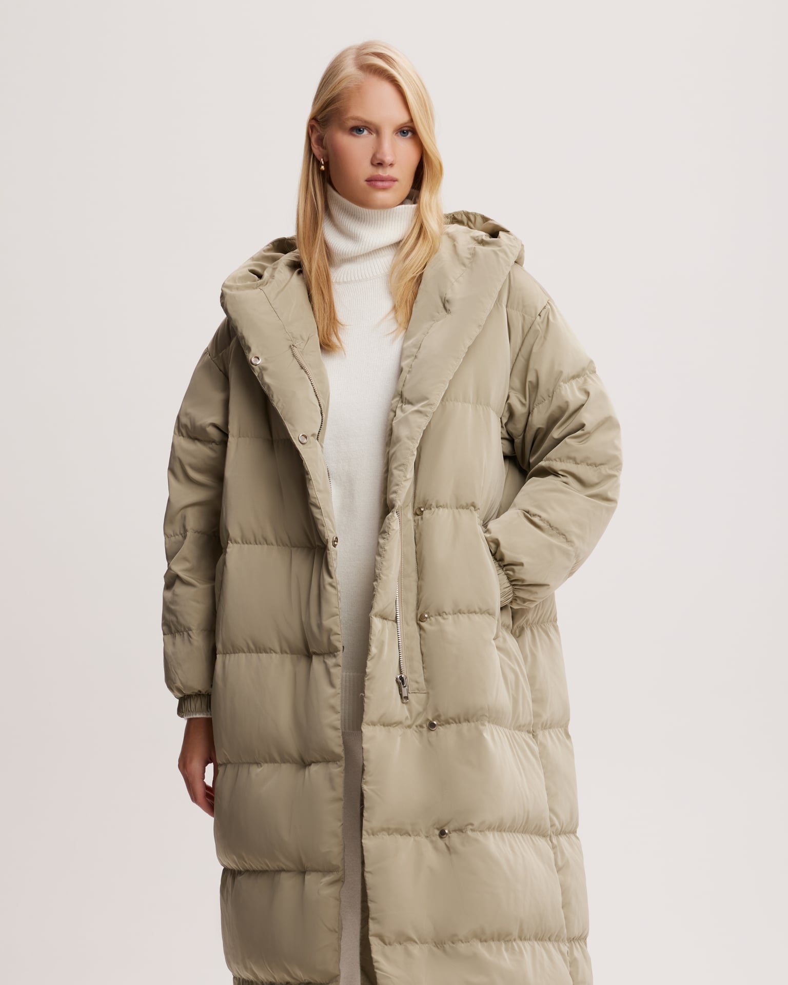 Khaki puffer jacket with snap fasteners