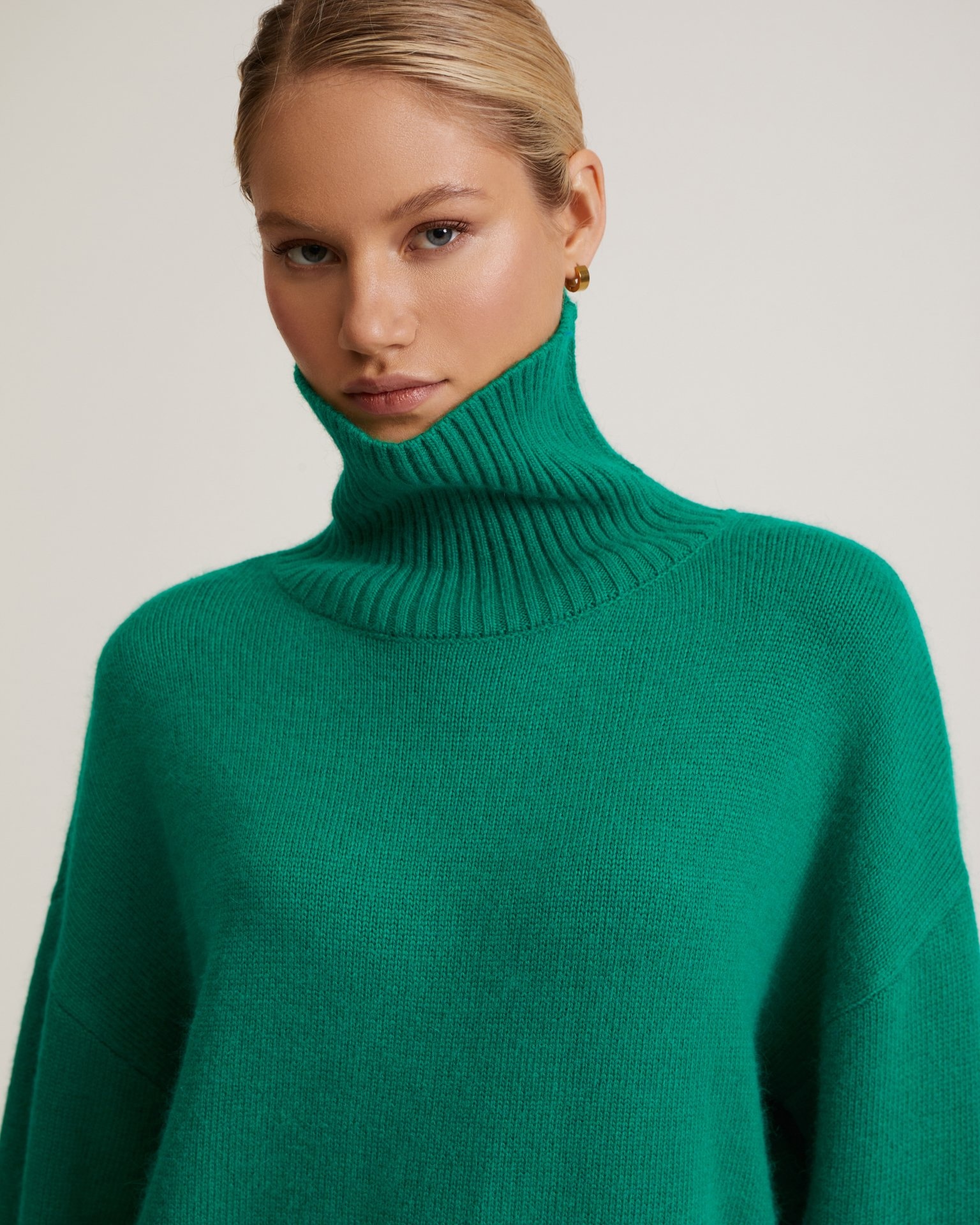Green high-neck jumper
