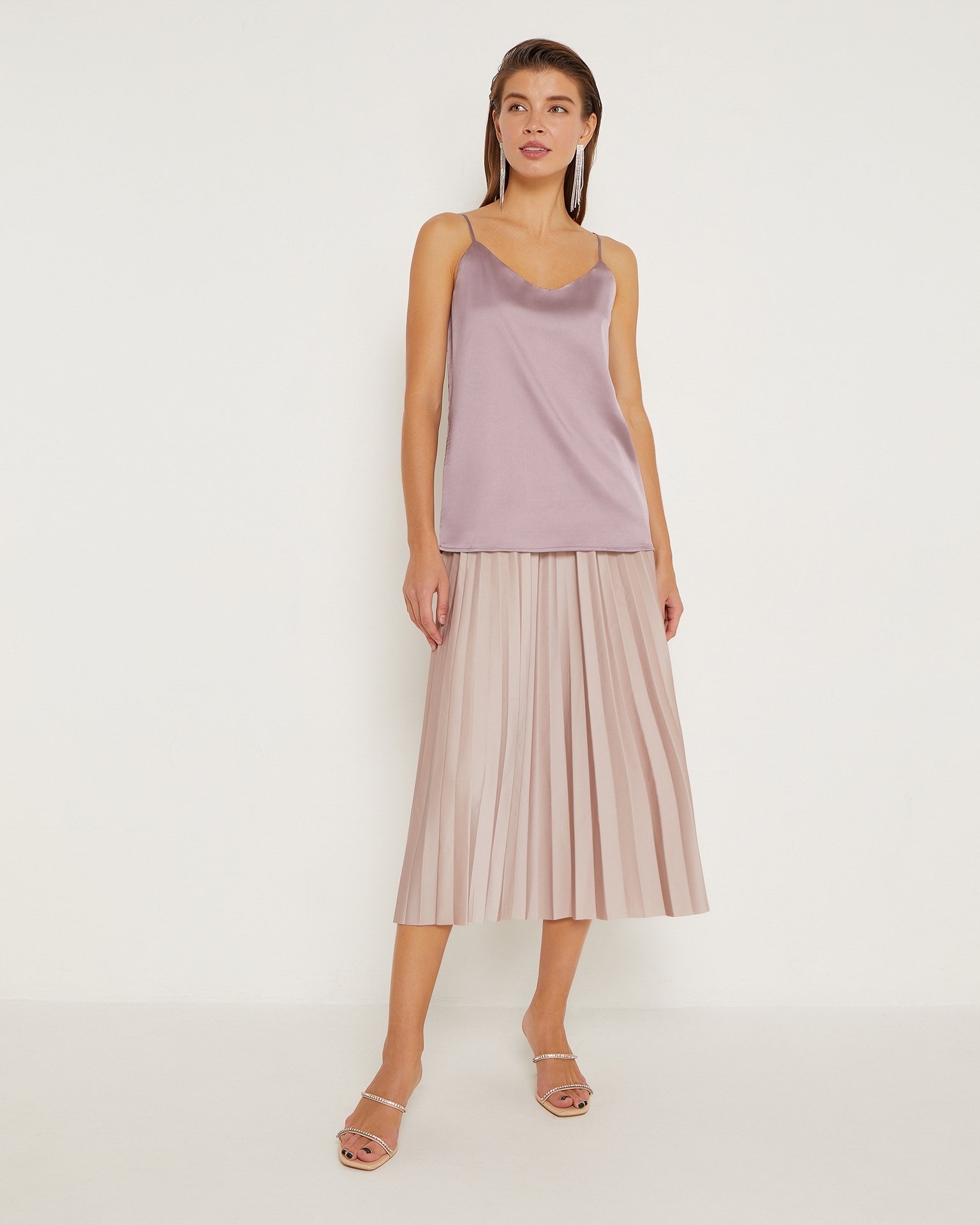 A long pleated skirt in beige