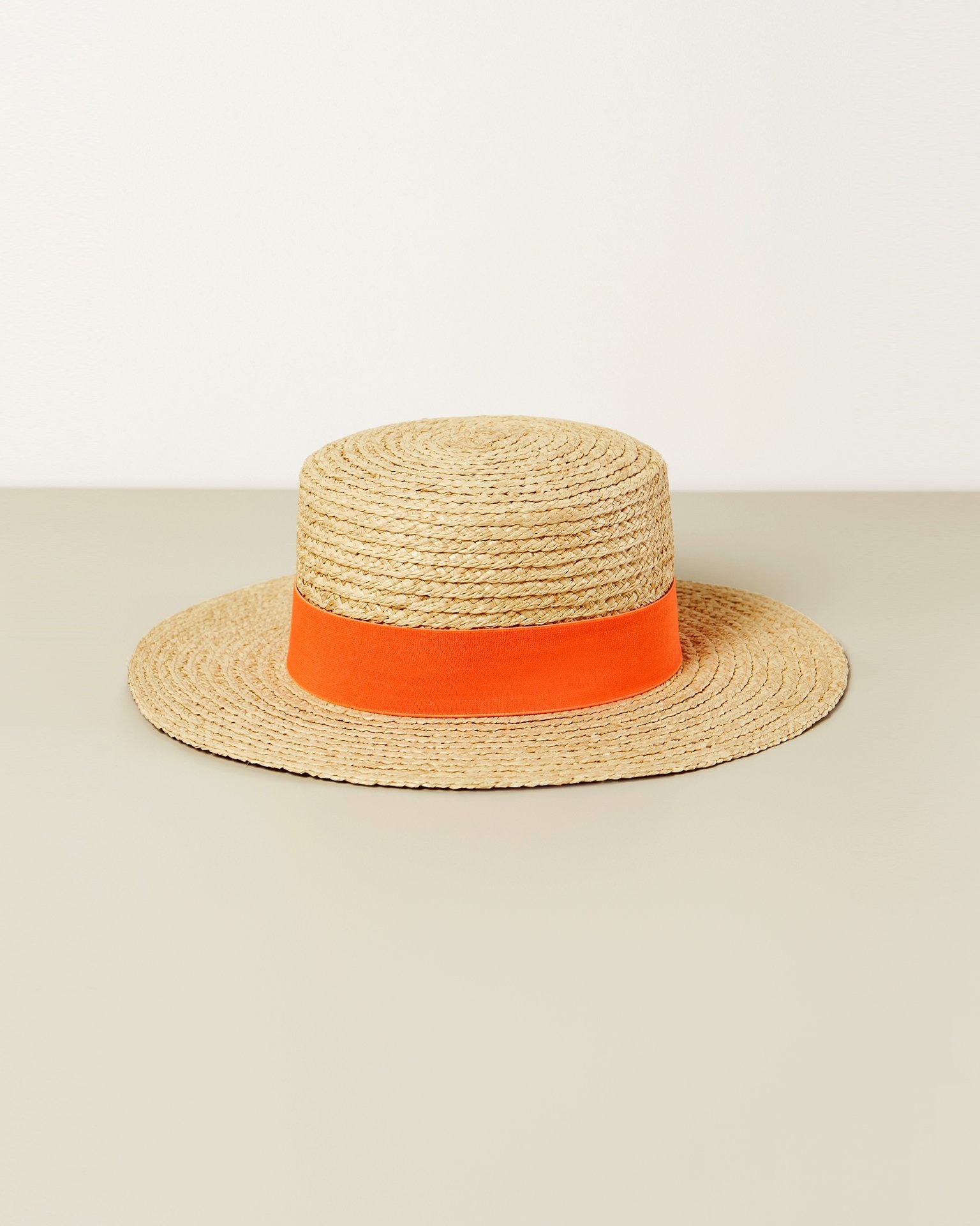A hat with a contrasting ribbon