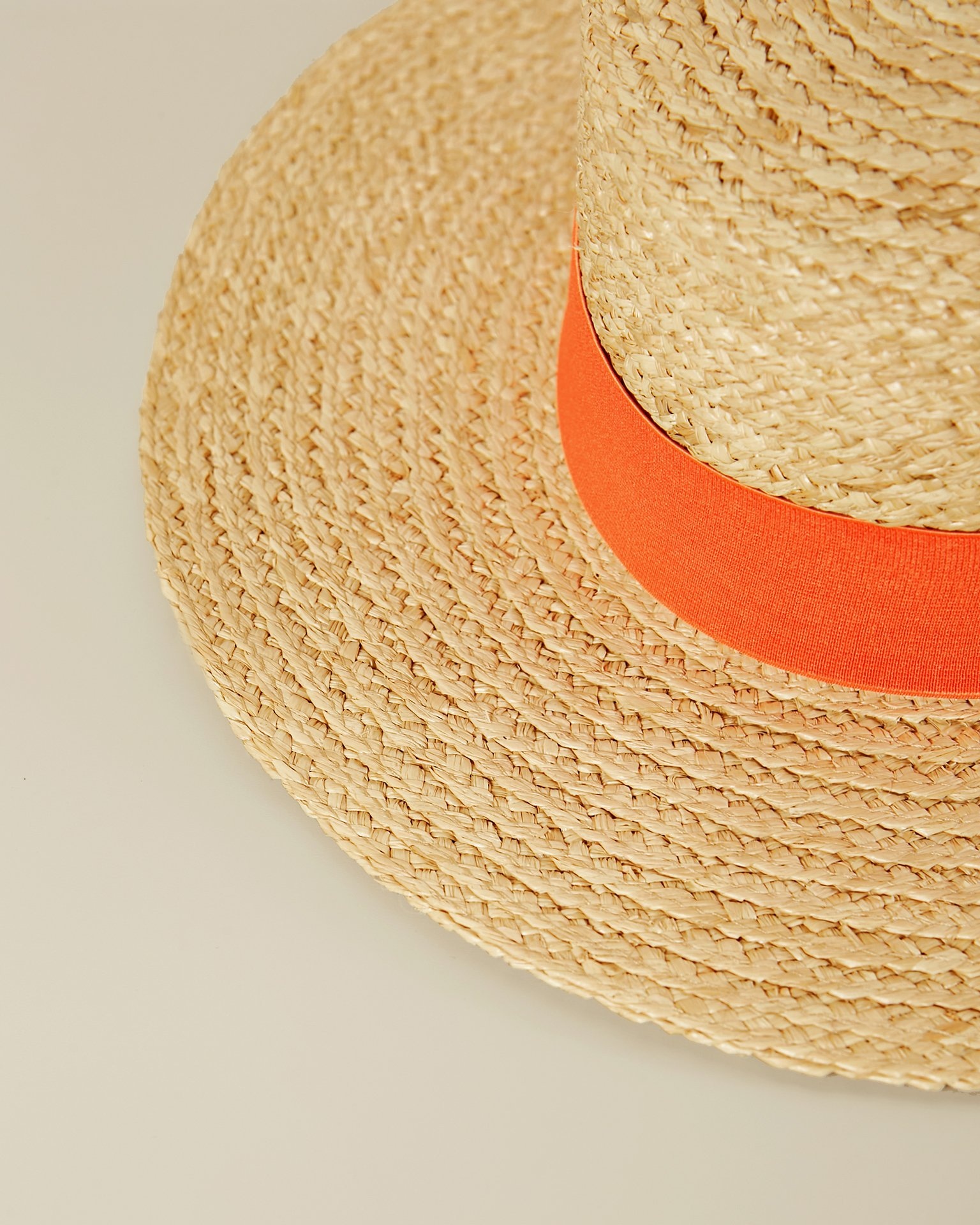 A hat with a contrasting ribbon