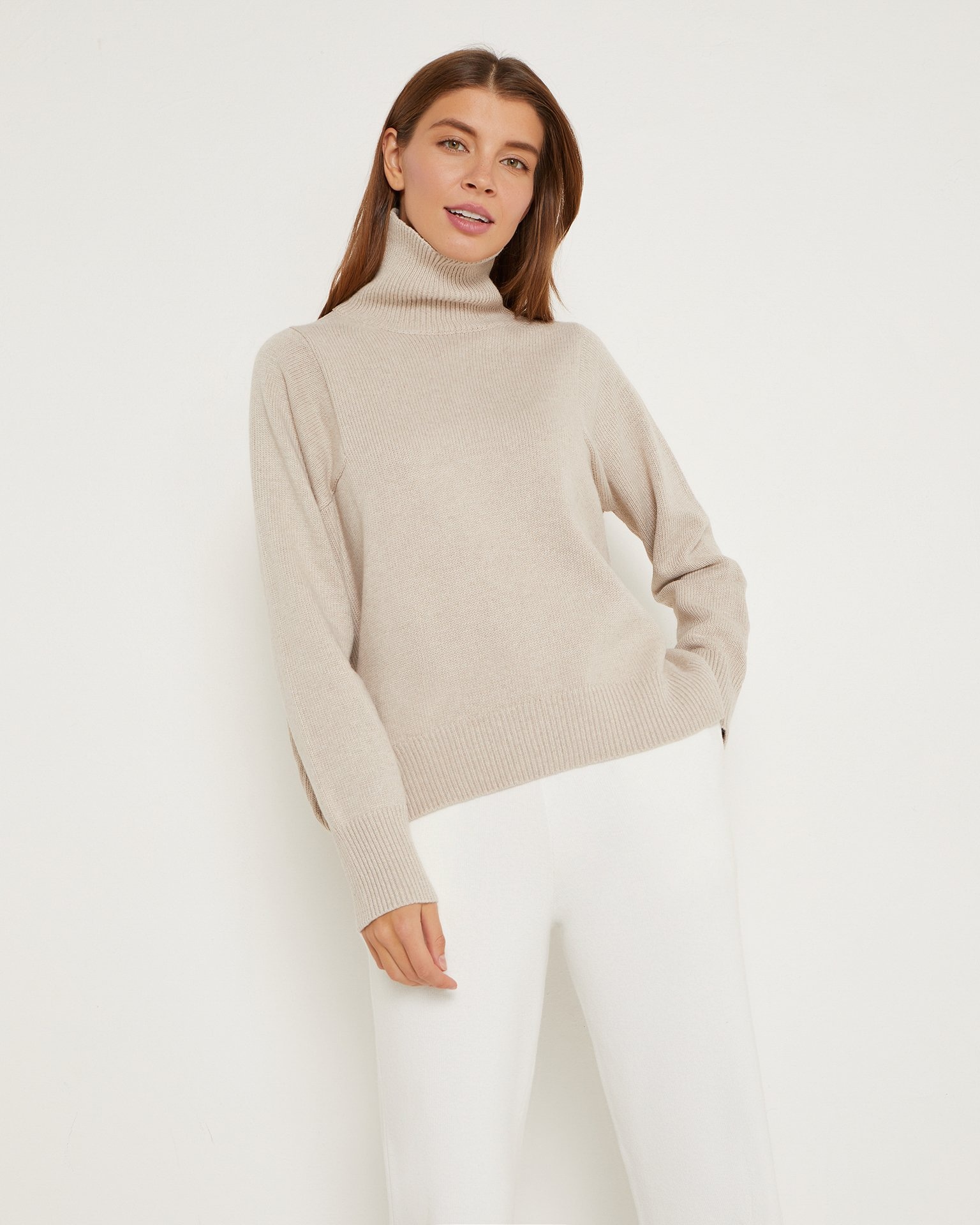 A basic turtleneck jumper in beige