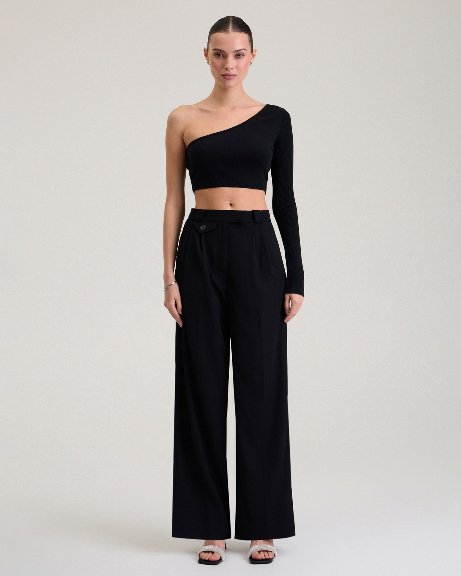 Trousers with decorative pocket in black