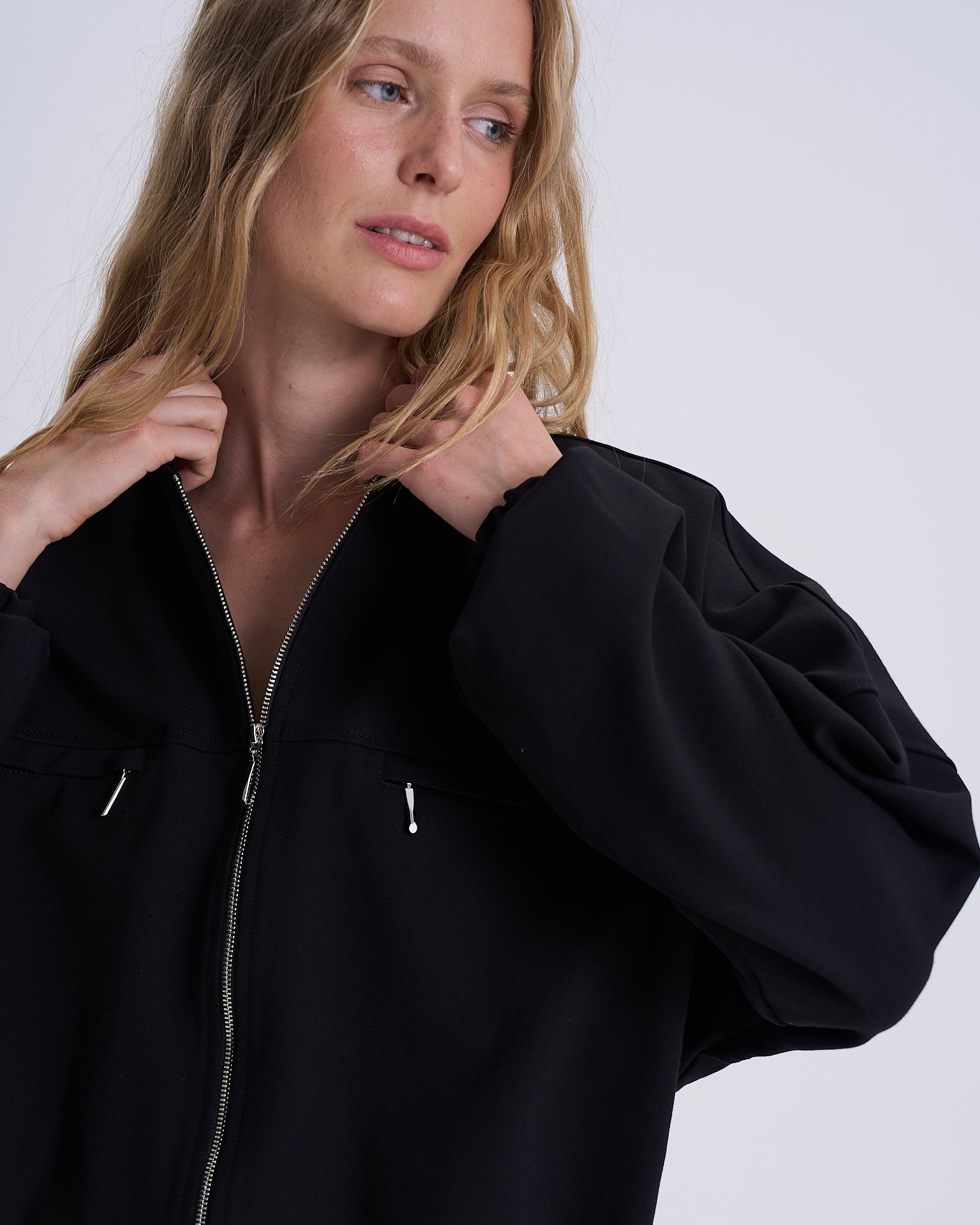 Black bomber jacket with adjustable ribbed hem