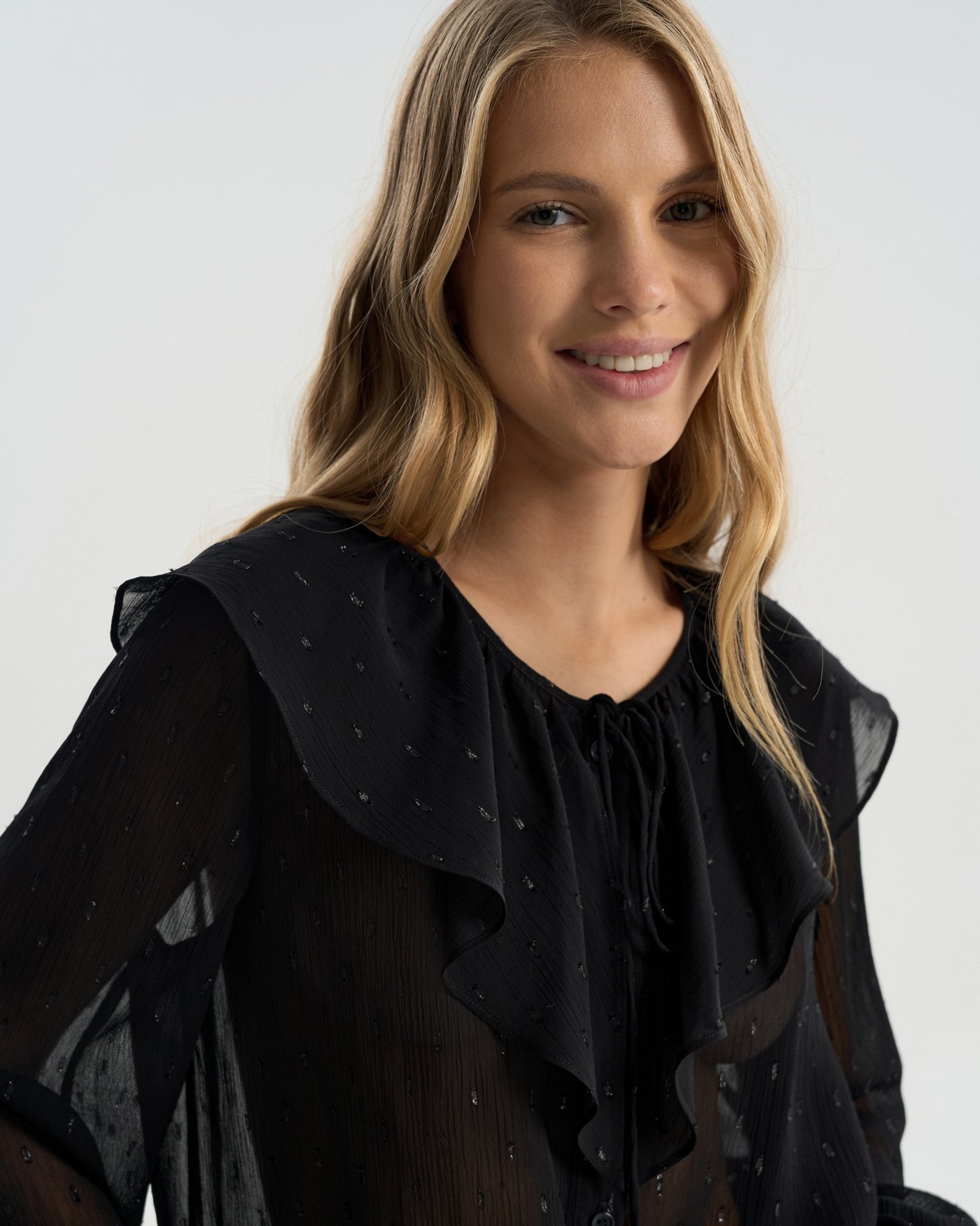 Sheer blouse with a flounce collar