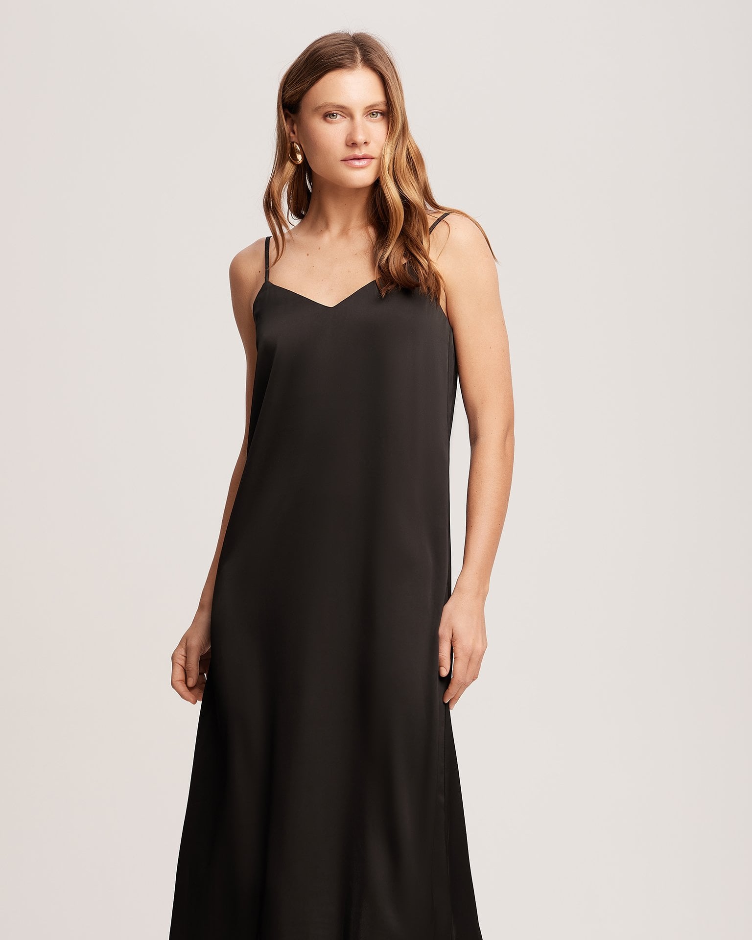 A black slip dress