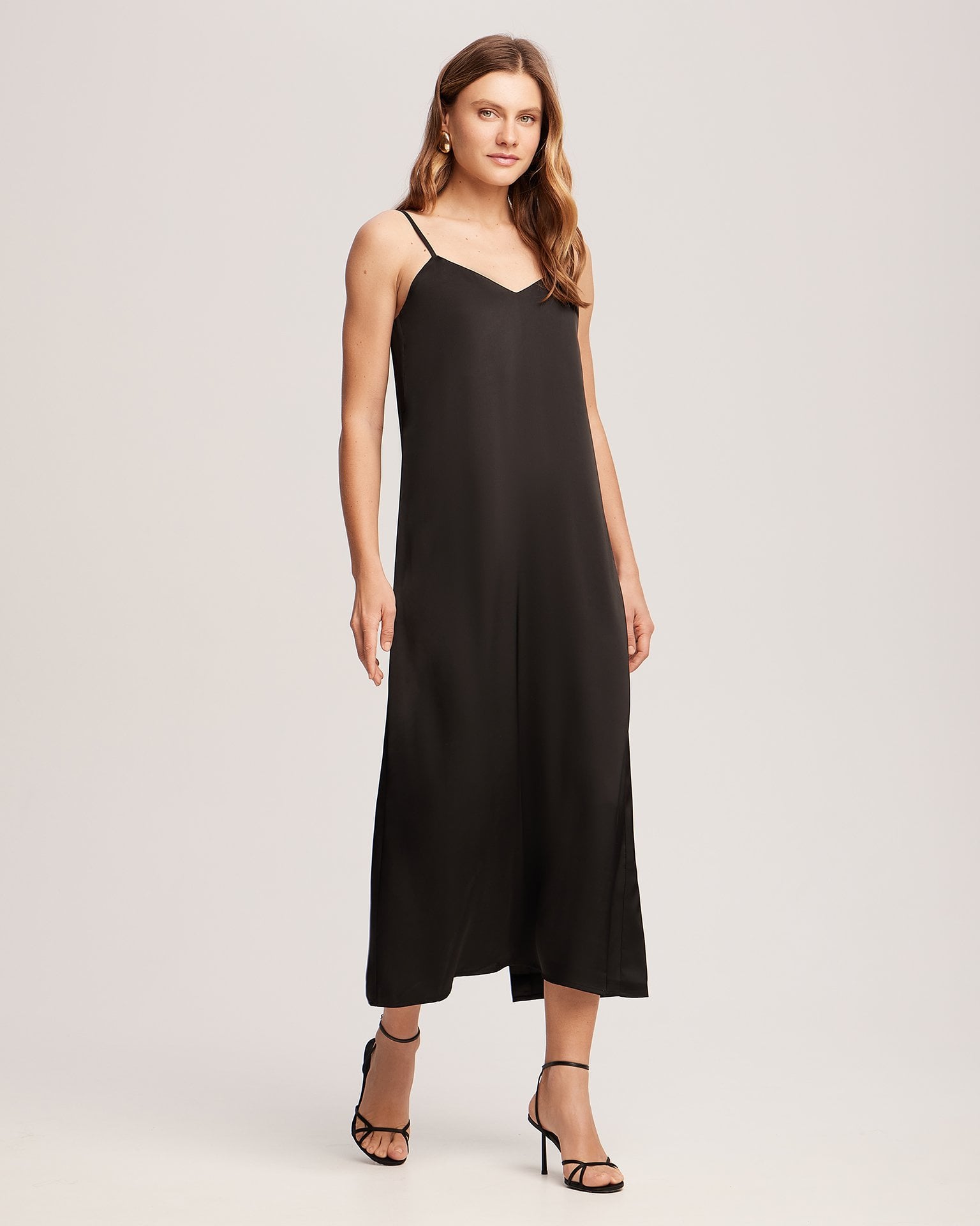 A black slip dress