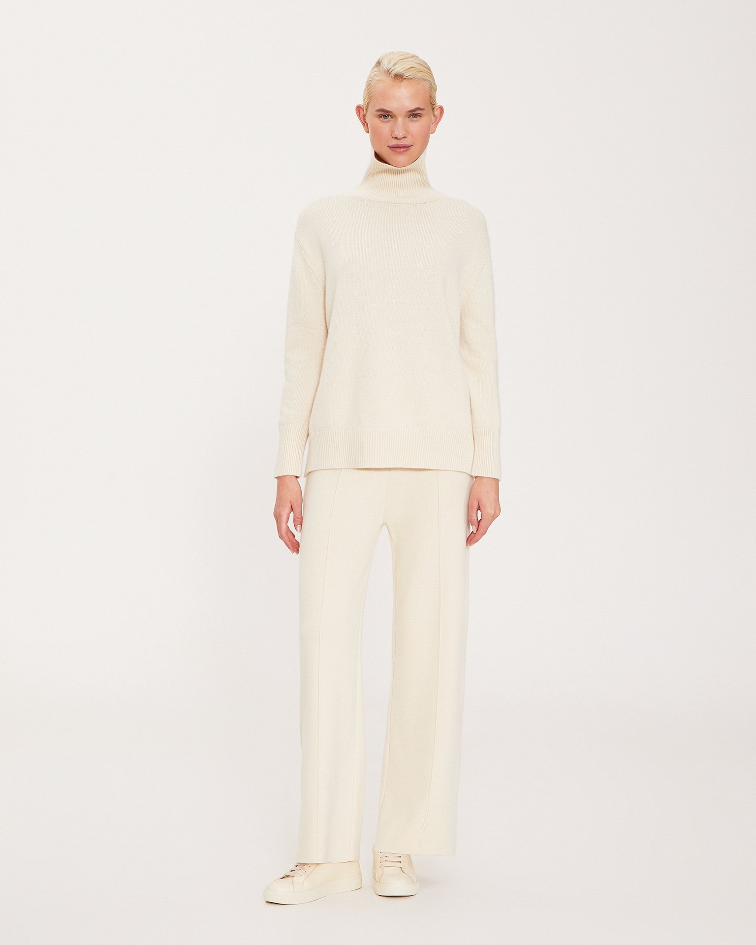 A knitwear suit in a milky colour