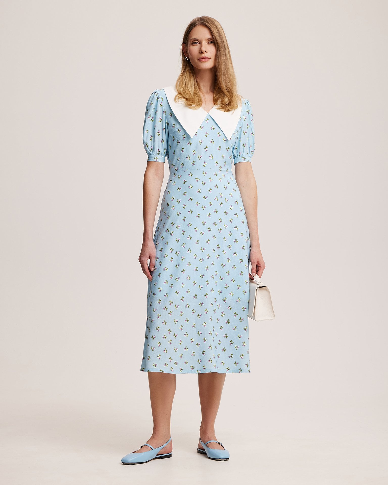 Blue dress with a white collar